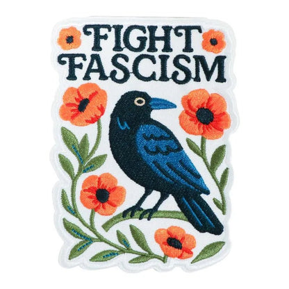 Embroidered patch with a crow, flowers, and 'Fight Fascism' text 