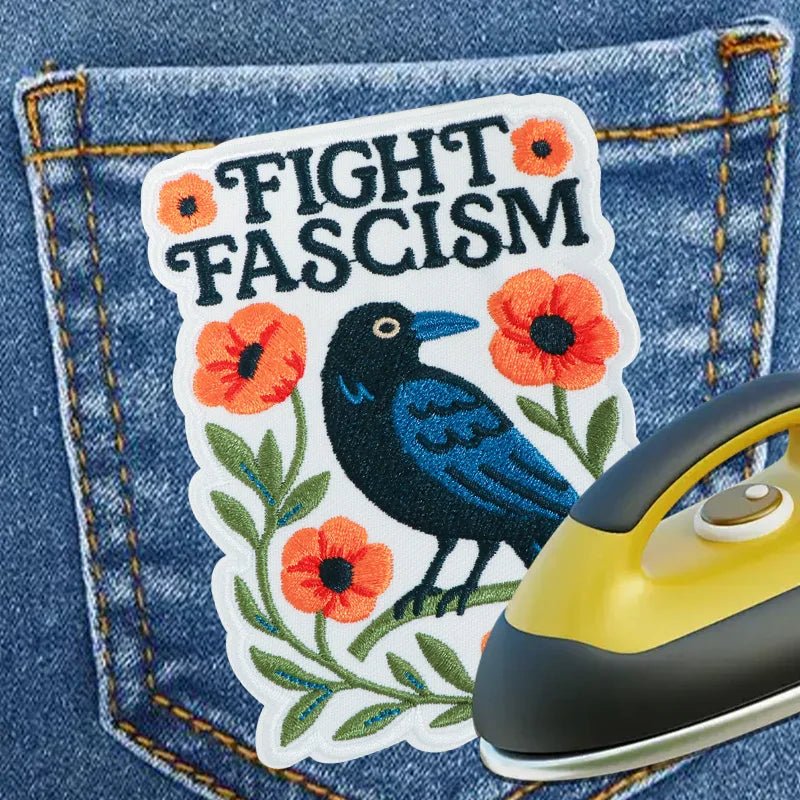 Embroidered patch with 'Fight Fascism' text and a bird design 