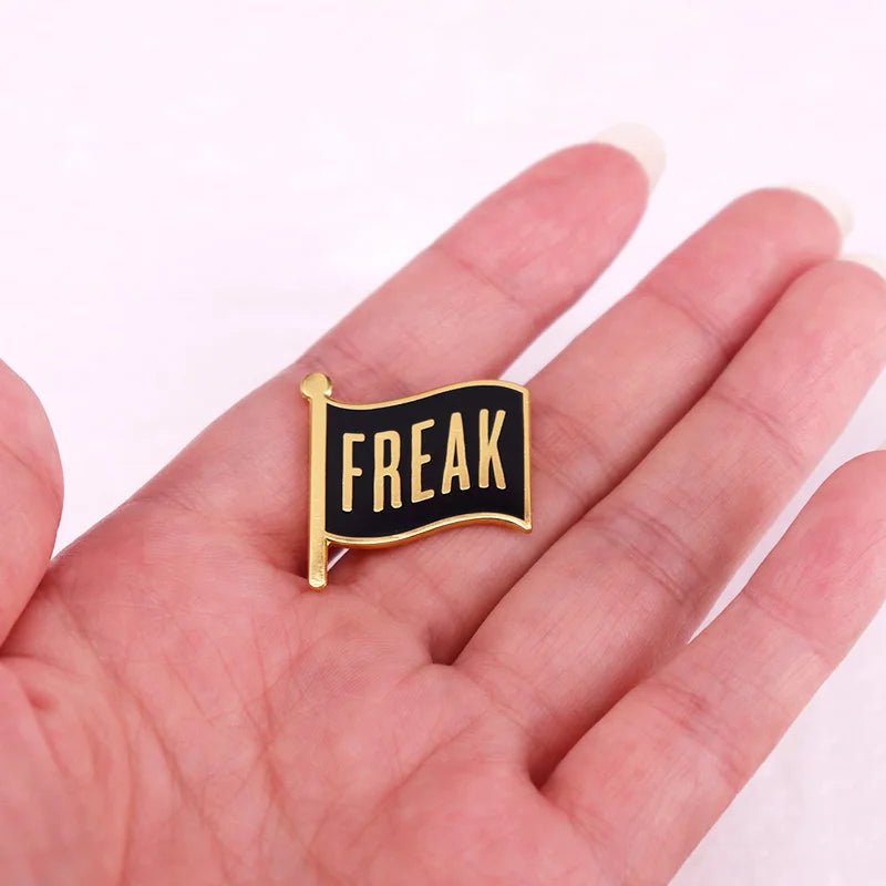 Black and gold Freak Flag enamel pin