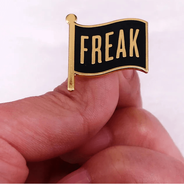 Black and gold Freak Flag enamel pin