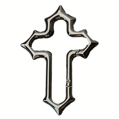 Black Gothic cross carabiner with pointed edges and a closed side gate on a white background.
