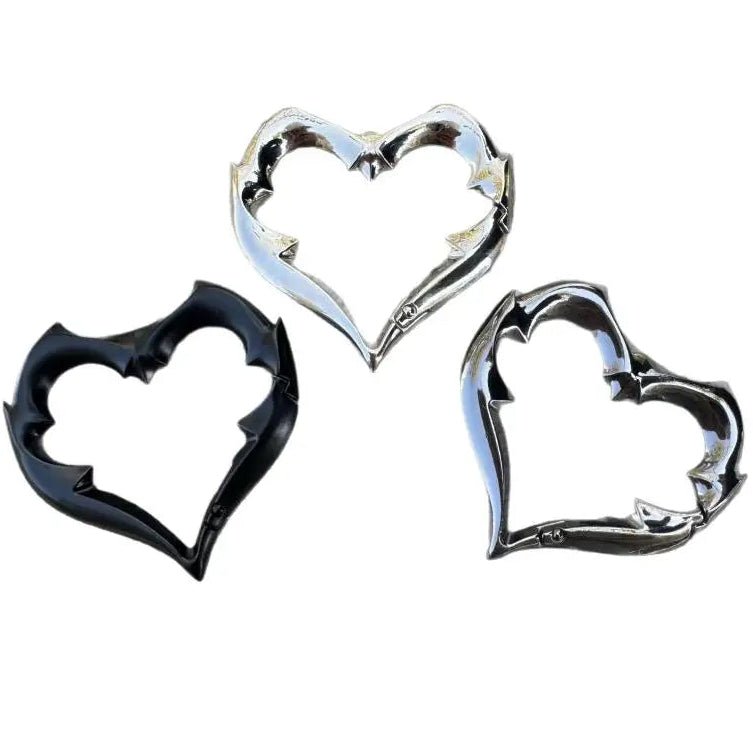 Gothic Heart Carabiner Keychain set featuring three heart-shaped carabiners with decorative spikes in black, silver, and dark chrome finishes.