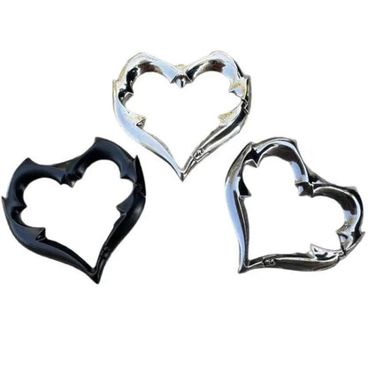 Gothic Heart Carabiner Keychain set featuring three heart-shaped carabiners with decorative spikes in black, silver, and dark chrome finishes.
