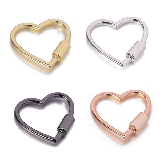 Four Heart Shaped Locking Carabiners in gold, silver, black, and rose gold are shown on a white background, arranged in a two-by-two grid.
