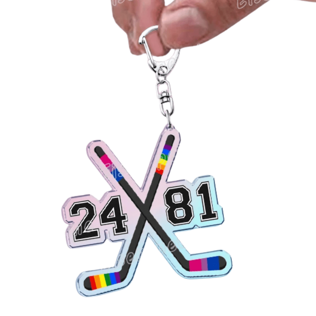 Heated Rivalry Rainbow and Bisexual Keychain with crossed hockey sticks and numbers 24 and 81 