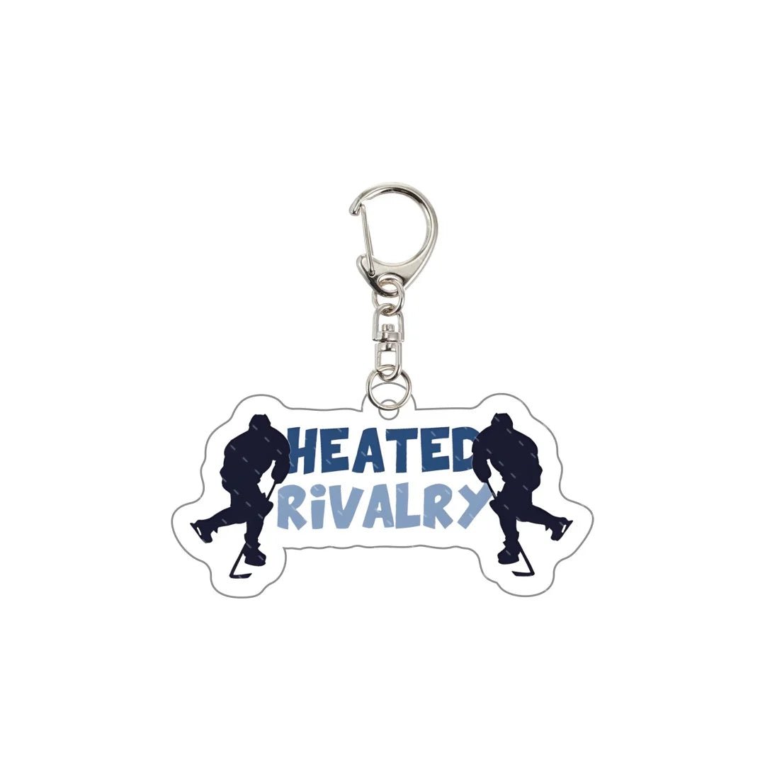 Keychain with 'Heated Rivalry' text and hockey silhouette design 