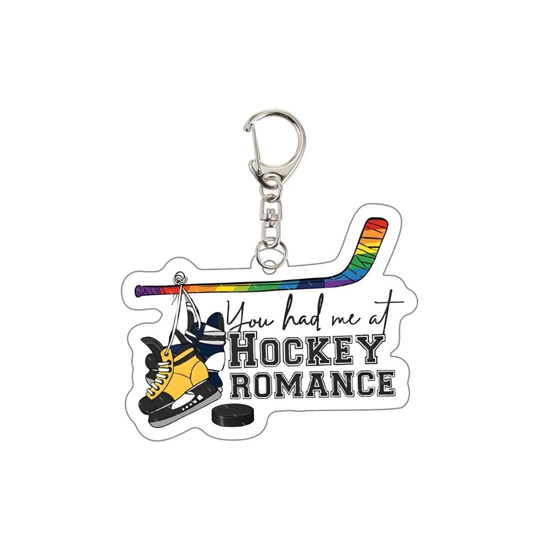 Heated Rivalry Keychain with rainbow hockey stick and ice skates and text 'You had me at Hockey Romance' 