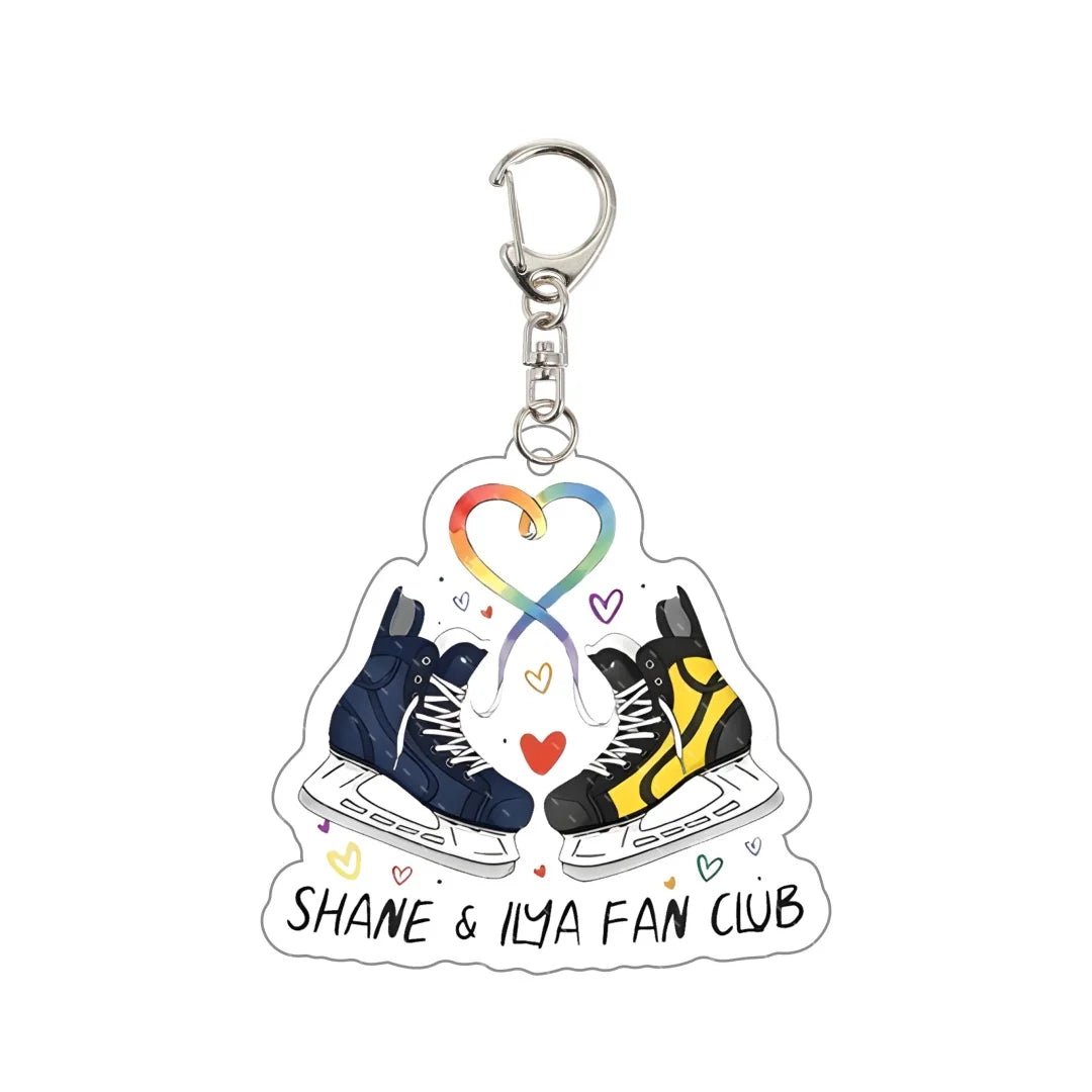 Heated Rivalry Keychain with ice skates and rainbow heart design, labeled 'Shane & Ilya Fan Club'.