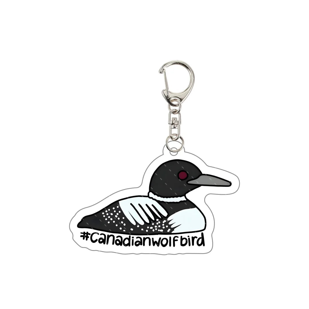 Keychain with a loon design and '#Canadianwolfbird' text 
