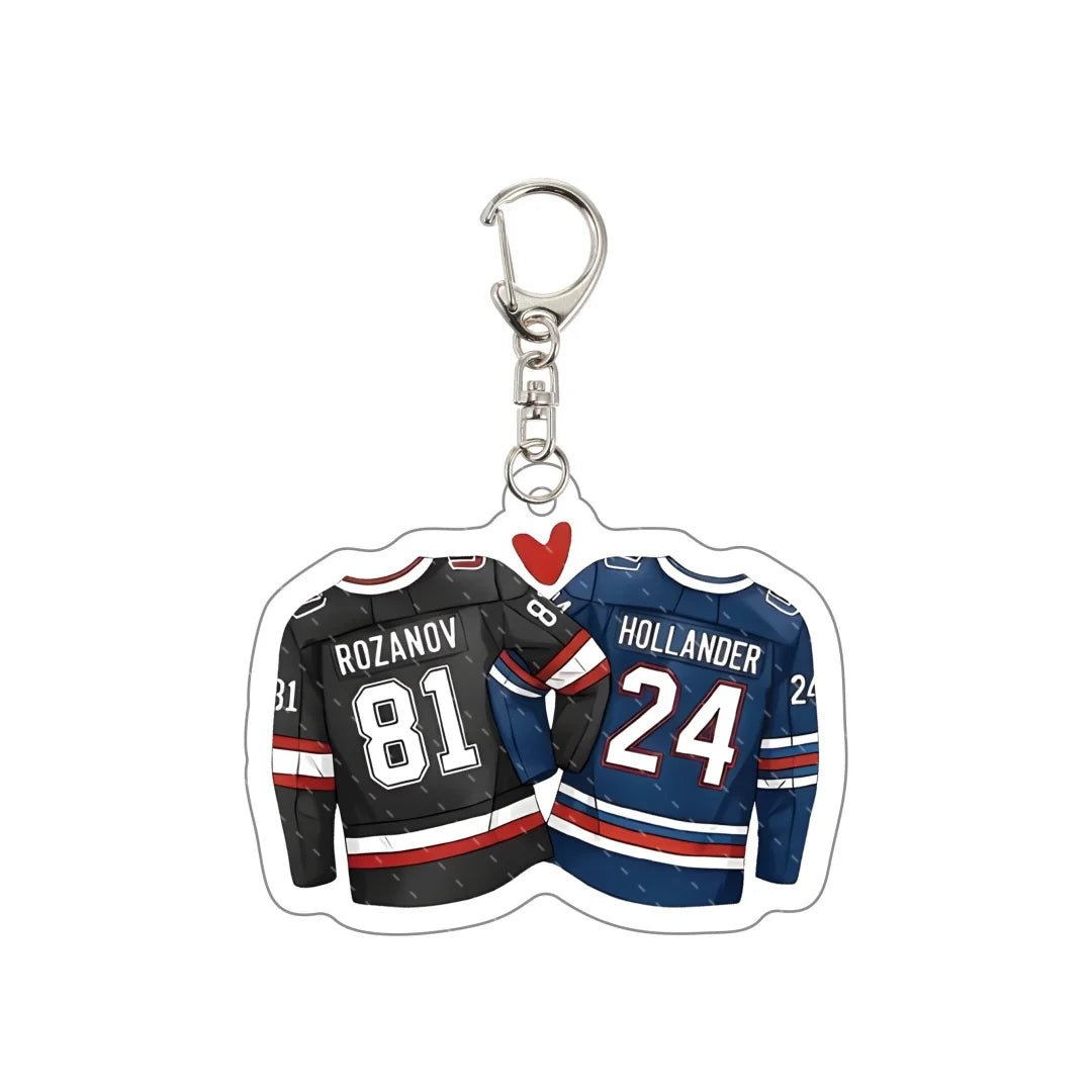 Keychain with two hockey jerseys, one black and one blue, featuring names and numbers Rozanov 81 and Hollander 24