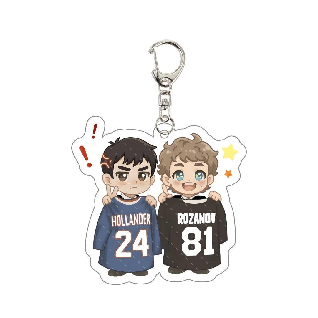 Heated Rivalry Keychain with cartoon characters wearing jerseys labeled 'Hollander' and 'Rozanov' 