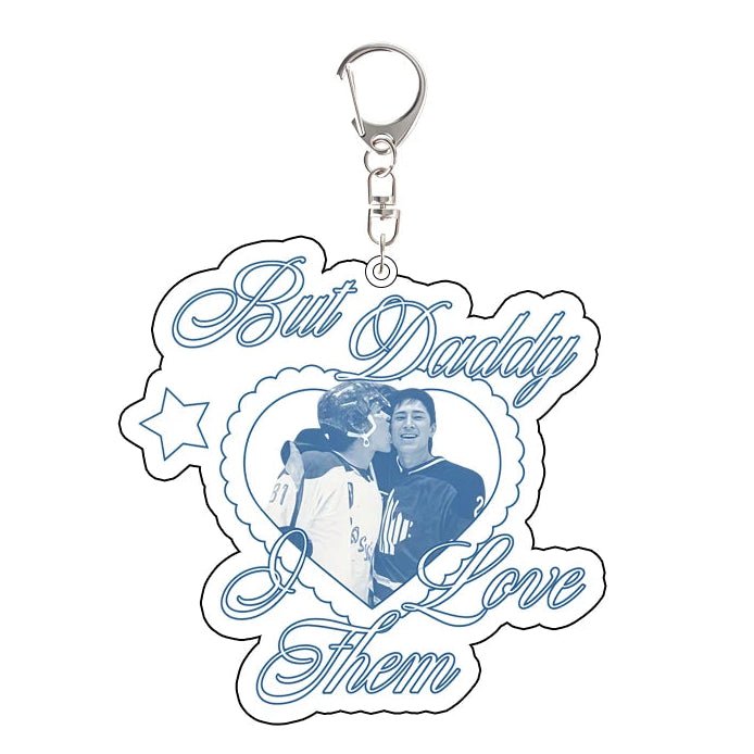 Heated Rivalry Keychain with a couple's photo and text 'But Daddy I Love Them' on a white background