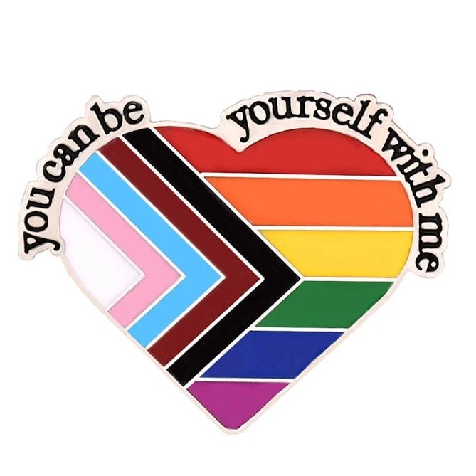 Heart-shaped rainbow flag badge with text 'You can be yourself with me' on a white background