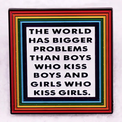 Pin with text 'The world has bigger problems than boys who kiss boys and girls who kiss girls' on a rainbow border.