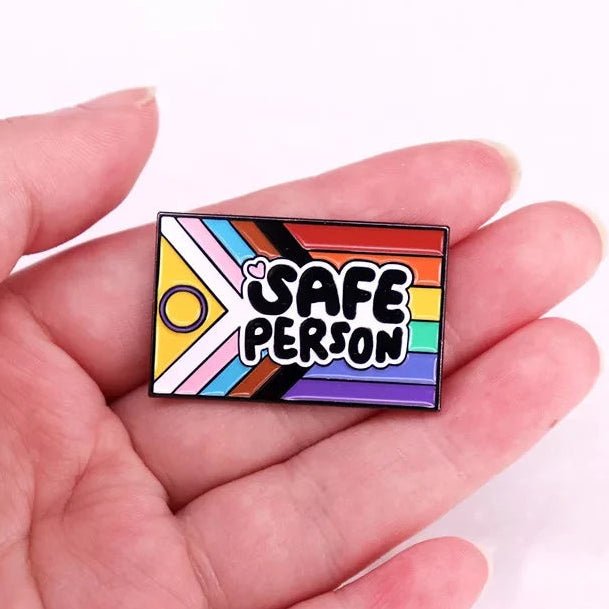 Inclusive rainbow pride flag pin that says 'SAFE PERSON' 