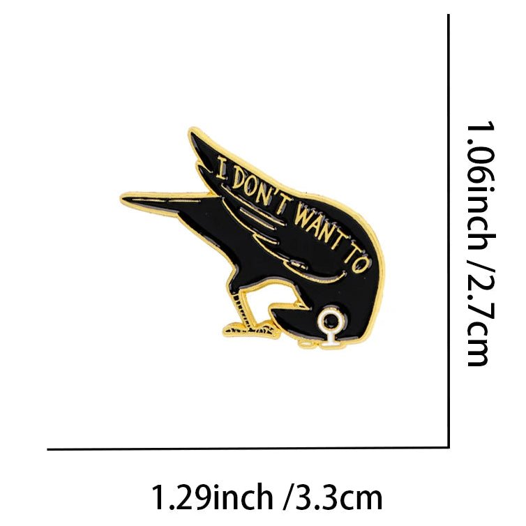 A black and gold bird enamel  with the text 'I DON'T WANT TO'