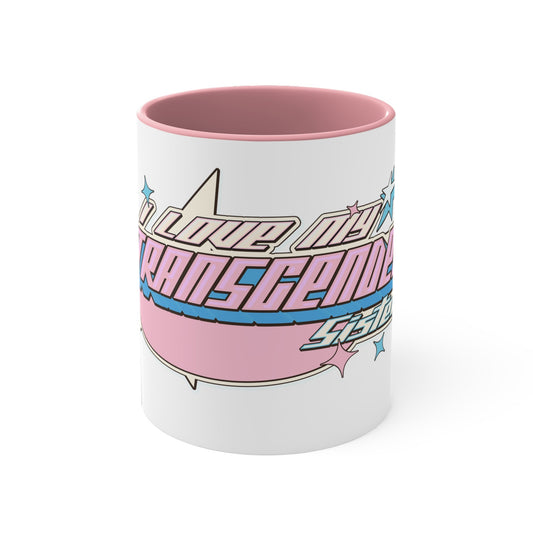 The "I Love My Transgender Sister" original design accent mug by Printify features a white exterior and a pink interior. It showcases a retro-style graphic with the bold text "I love my transgender self" across the center, adorned with light blue and pink star-shaped accents aligned to the left and right of the text. This unique mug beautifully celebrates your identity.