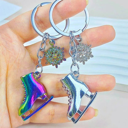 Keychains shaped like ice skates with snowflake charms 