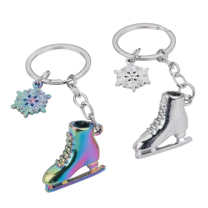 Two keychains with ice skate and snowflake charms 