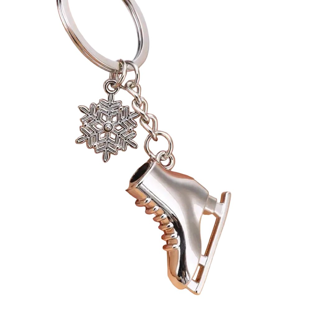 Silver ice skate and snowflake keychain background