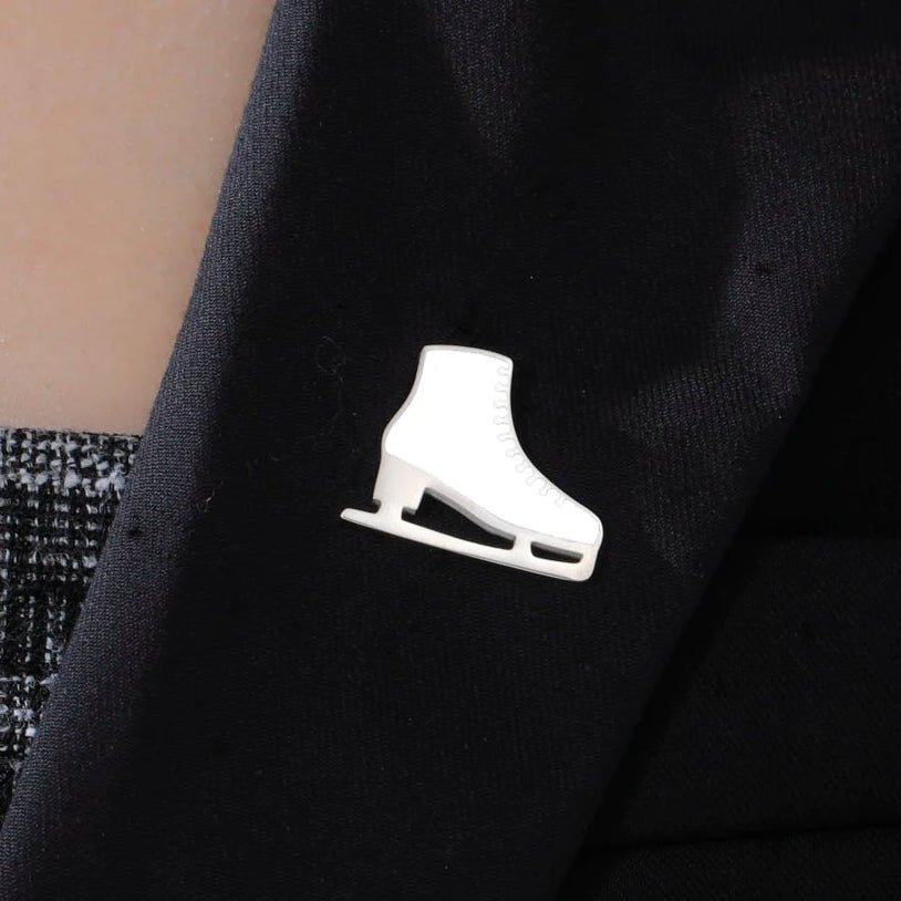 White and silver ice skate figure skate badge