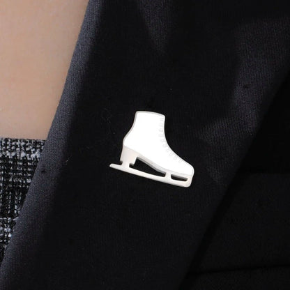 White and silver ice skate figure skate badge