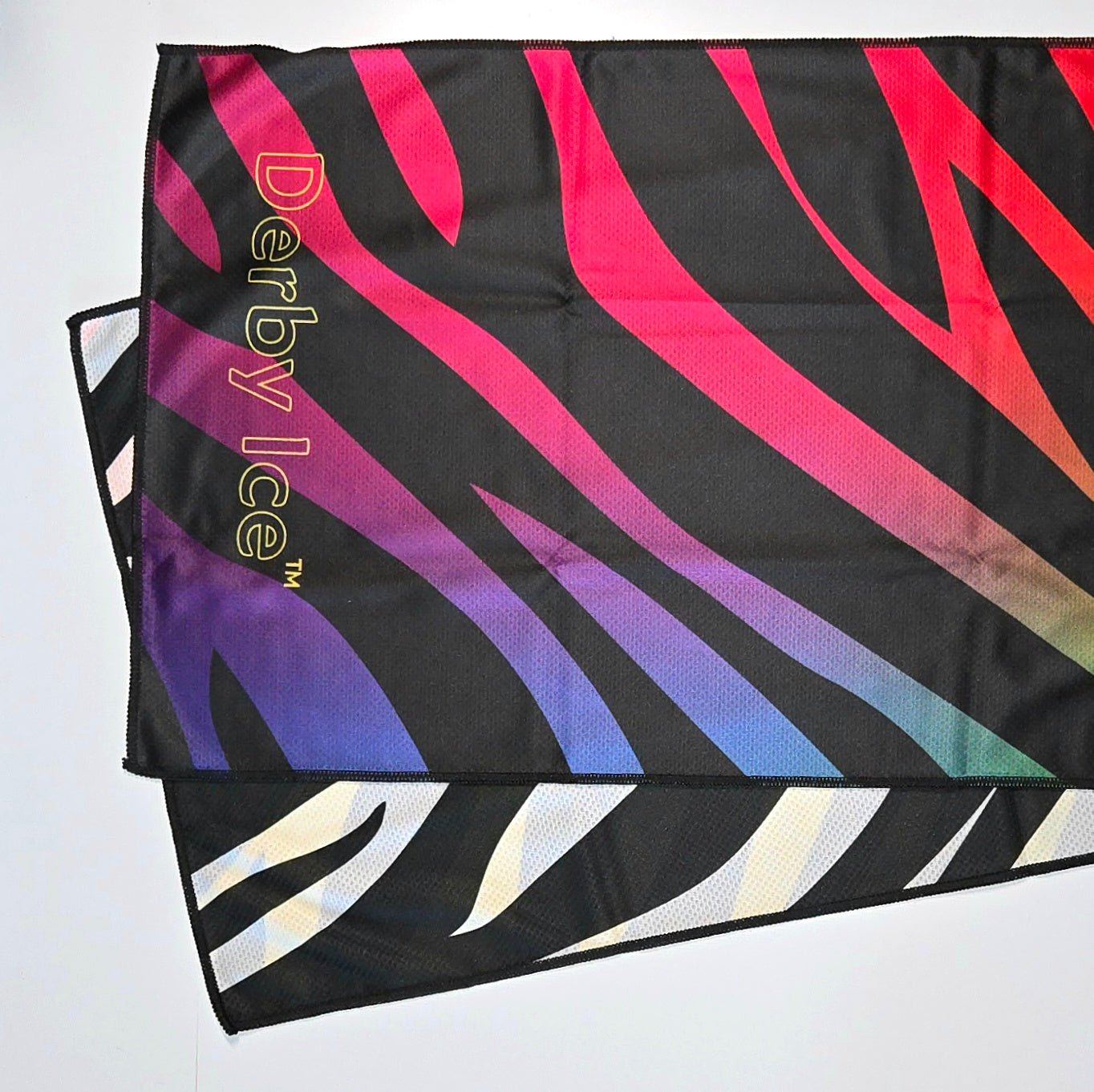 Colorful zebra and rainbow-striped towel from 'Derby Ice'