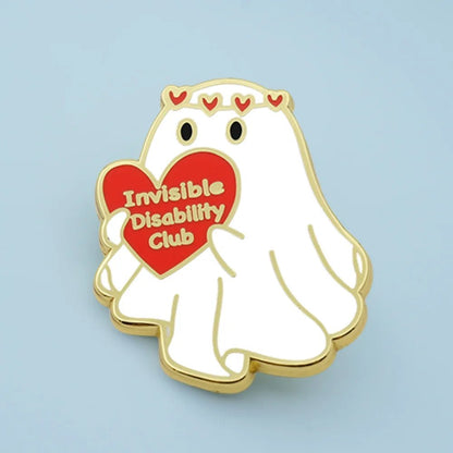 Ghost pin with a red heart that says 'Invisible Disability Club' on a light blue background