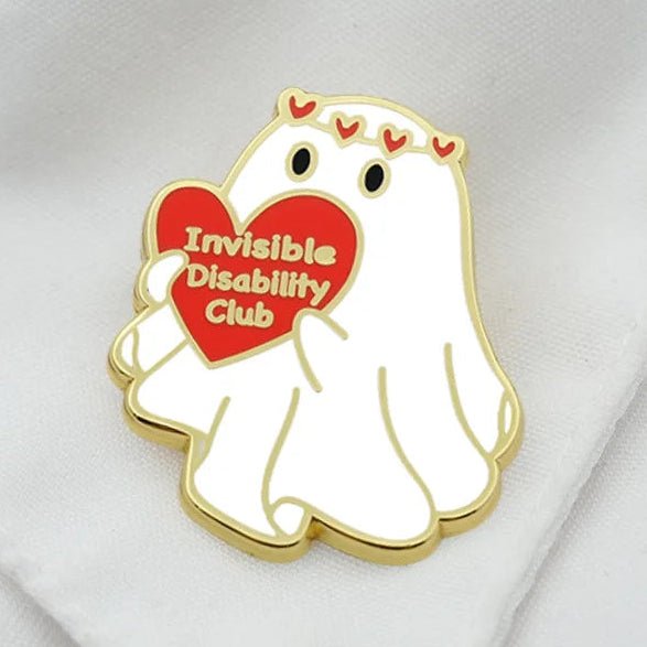 Pin with a cartoon ghost holding a red heart that says 'Invisible Disability Club' 