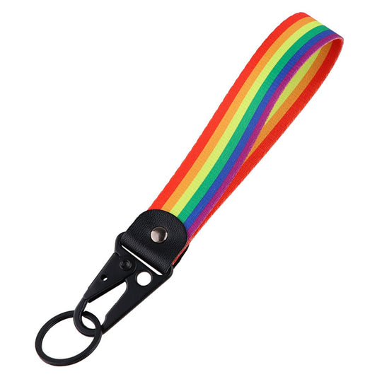 The Key chain clip on lanyard - rainbow pride flag features a short fabric strap with rainbow stripes and a black metal clip and keyring on one end.