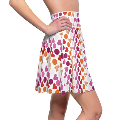 Introducing the "Subtle Lesbian Pride Flag Polka Dot Skater Skirt" – a stylish, high-waisted design adorned with a vibrant pattern of alternating pink, purple, and orange hearts and small roller skate images on a white background. This flared, A-line skirt beautifully captures the essence of the lesbian pride flag.