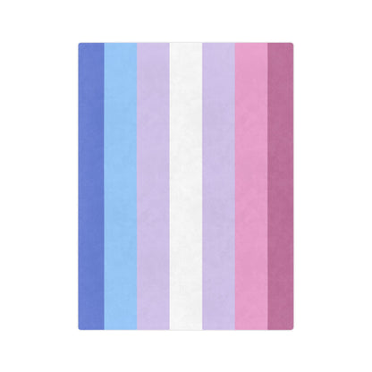 The Printify Minky Blanket Bigender Pride Flag, crafted from velveteen microfiber, features vertical stripes of dark blue, light blue, light purple, white, light pink, darker pink, and dark purple. Perfect for celebrating trans and queer-owned businesses this winter with cozy warmth.