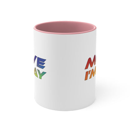 The MOVE I'M GAY accent mug by Printify features a clean white exterior with a striking blue handle and rim, and showcases bold, rainbow-colored "MOVE I'M GAY" text on its vibrant interior.