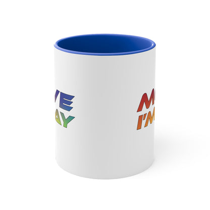 The MOVE I'M GAY accent mug by Printify features a clean white exterior with a striking blue handle and rim, and showcases bold, rainbow-colored "MOVE I'M GAY" text on its vibrant interior.