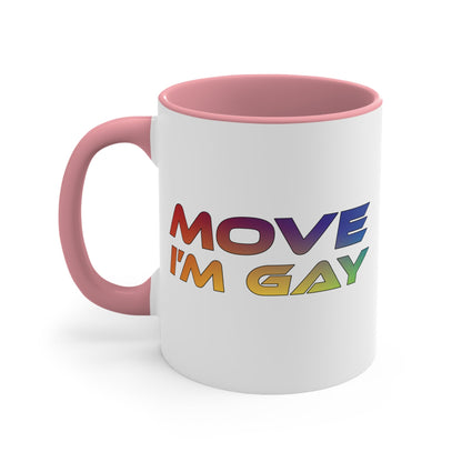 The MOVE I'M GAY accent mug by Printify features a clean white exterior with a striking blue handle and rim, and showcases bold, rainbow-colored "MOVE I'M GAY" text on its vibrant interior.