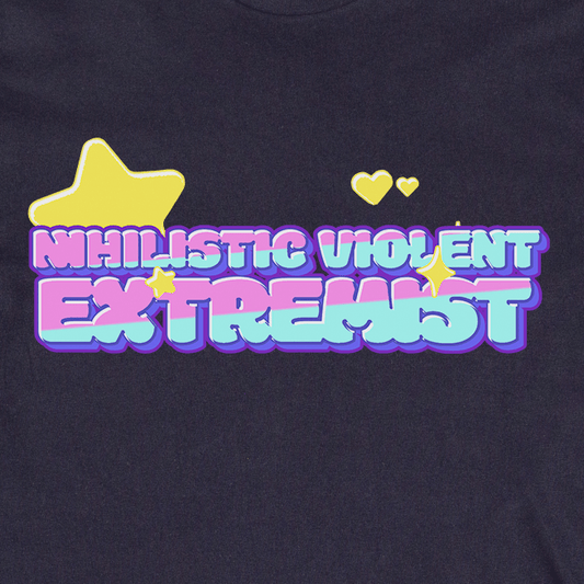 Bold, colorful bubble letters read "Nihilistic Violent Extremist," accented by stars and hearts on a dark background. This playful satire crop tee is locally printed and queer and trans owned.