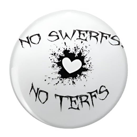 No Swerfs No Terfs button badge, featuring bold text over a black splash and white heart on a crisp white background. Trans rights badge