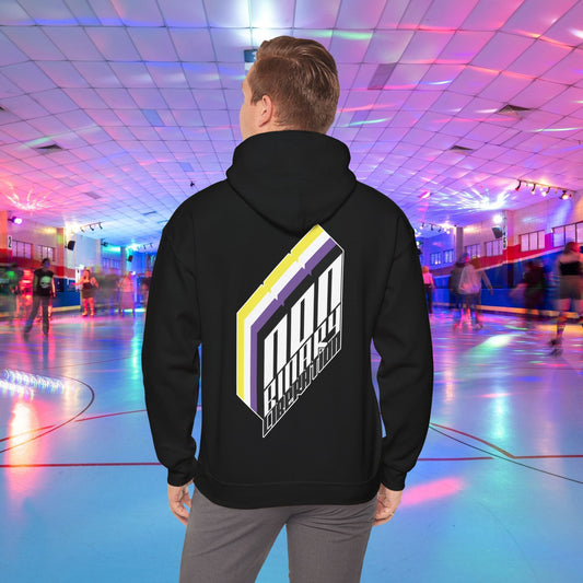 A person wearing the Non-Binary Liberation Hoodie - Australian Shipping by Printify, showcasing a vibrant geometric design on the back in nonbinary pride flag colours, stands in the middle of a roller skating rink. The rink is bathed in vibrant lights of various colors, with several people skating in the background.