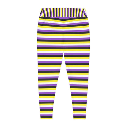 A person wearing Printify's Non-Binary Pride Flag Plus Size Leggings, sizes 2XL - 6XL, which feature high-waisted, colorful horizontal stripes in black, purple, yellow, and white. Made from 4-way stretch fabric for comfort and flexibility, they stand with their feet slightly apart. Only their legs and part of their torso are visible. They are also wearing white sneakers.