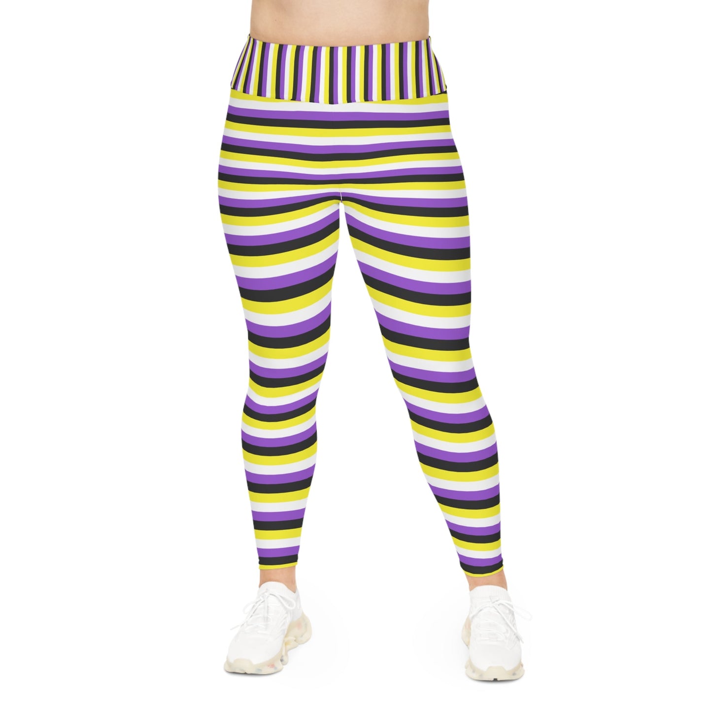 A person wearing Printify's Non-Binary Pride Flag Plus Size Leggings, sizes 2XL - 6XL, which feature high-waisted, colorful horizontal stripes in black, purple, yellow, and white. Made from 4-way stretch fabric for comfort and flexibility, they stand with their feet slightly apart. Only their legs and part of their torso are visible. They are also wearing white sneakers.