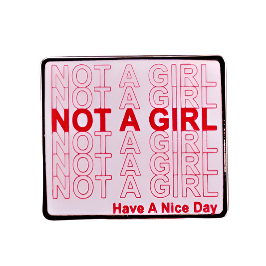 Enamel pin with 'Not a girl, have a nice day' in red text 