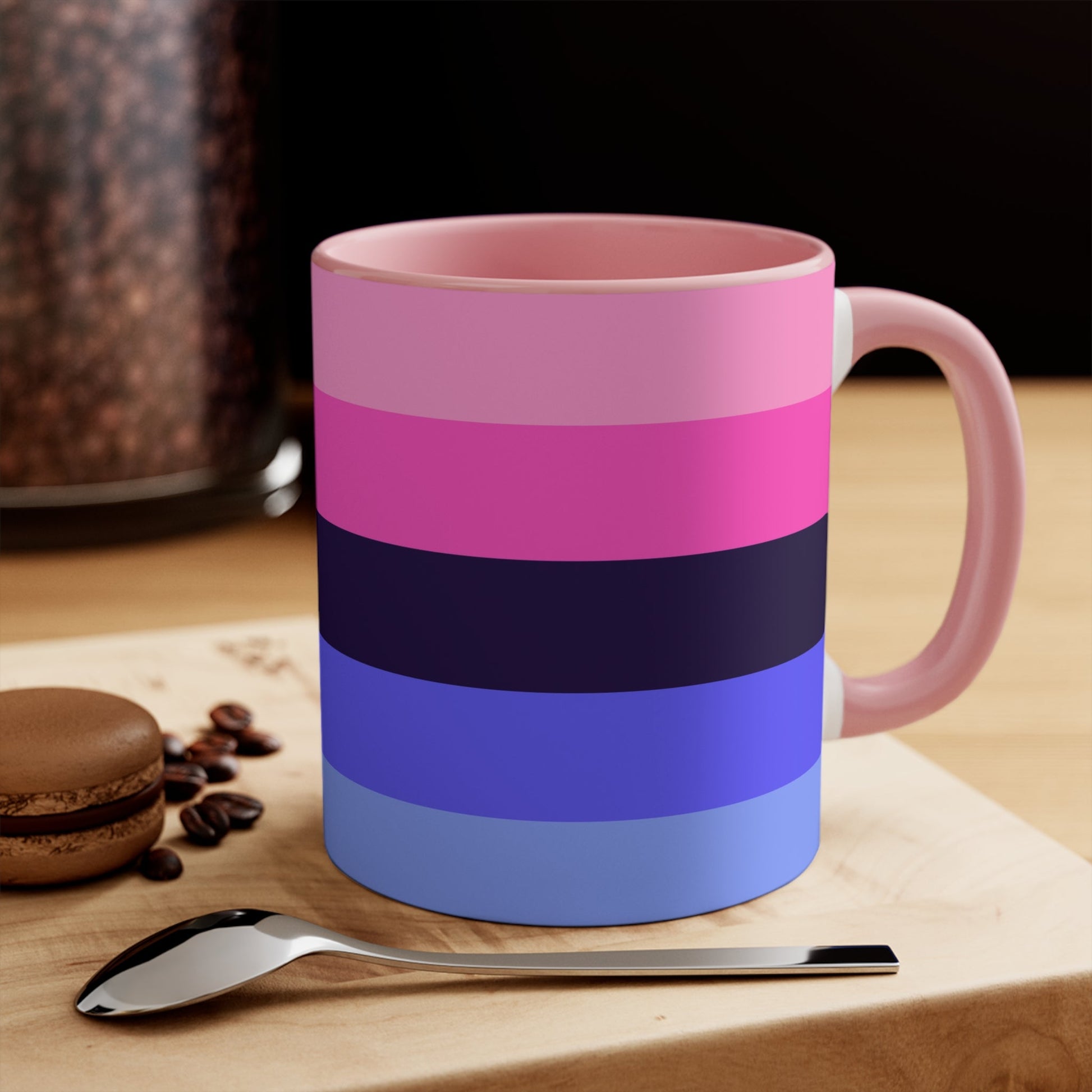 The Omnisexual Pride Flag - love hearts - colourful accent mug from Printify boasts an eye-catching design with a blue handle and inner surface, adorned with horizontal stripes in various shades of pink, purple, and blue.