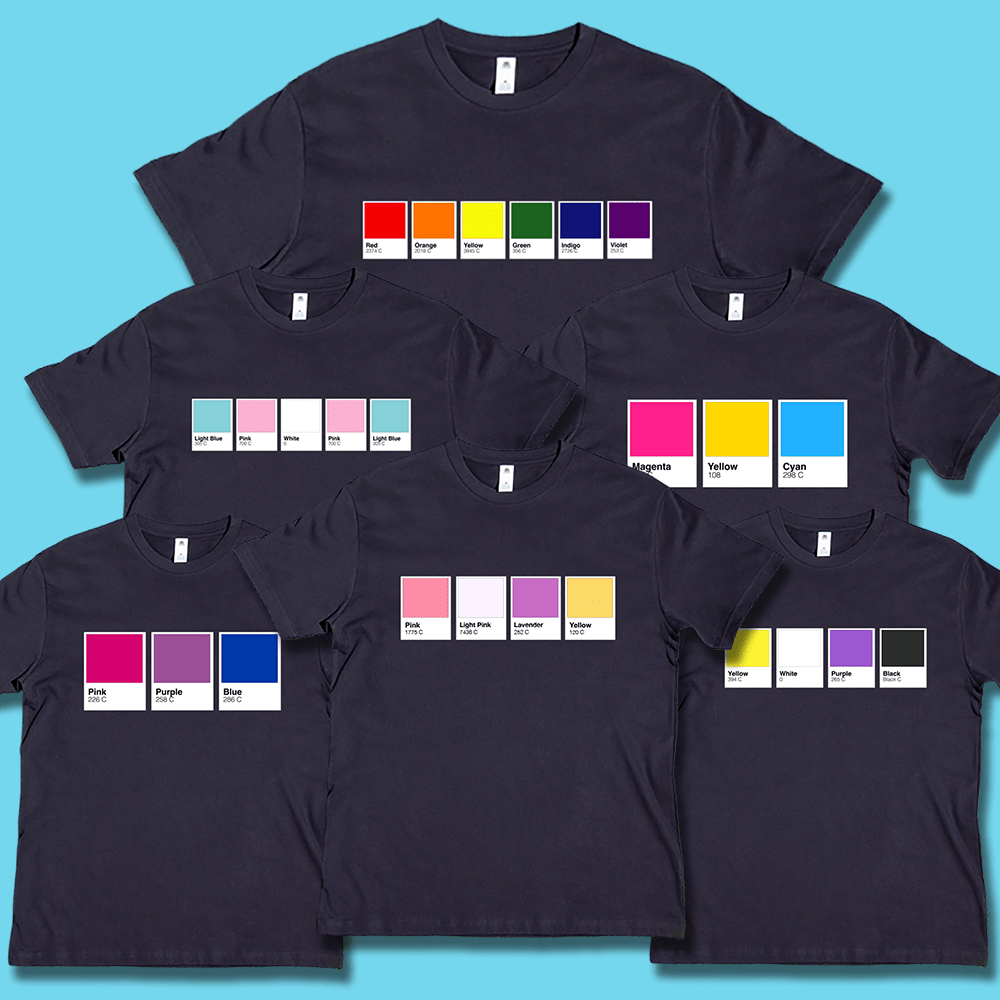 Black t-shirts arranged in a fan layout, each printed with Pantone color card graphic matching a pride flagon the chest including rainbow, transgender, pansexual, bisexual sapphic and non-binary pride flags