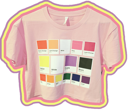 A bubblegum pink cropped tee featuring a colourful grid of pantone pride swatches based on pride flags - lesbian, non-binary and rainbow