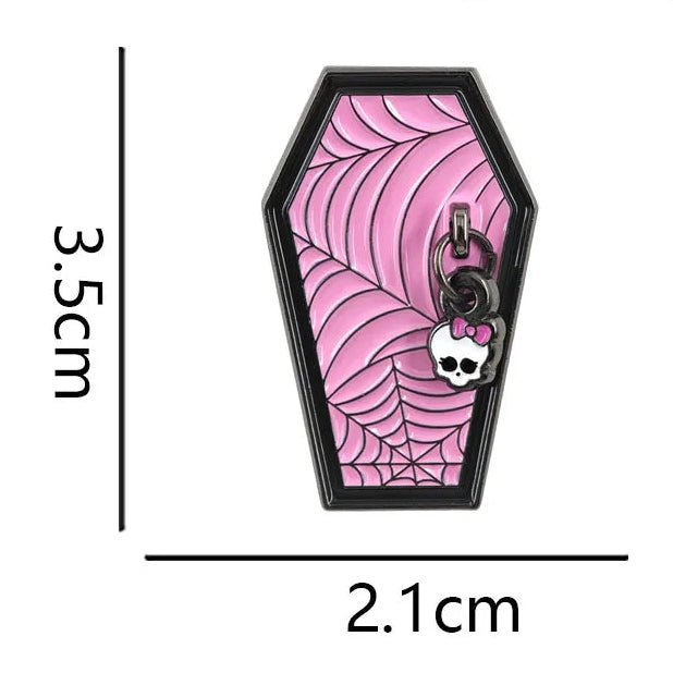 A coffin-shaped enamel pin with a pink spiderweb pattern and a skull-and-lock detail, shown with dimension lines and text indicating height of 3.5cm, width of 2.1cm