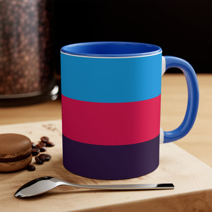 The Polyamory Pride Flag cup - colorful accent mug by Printify features a white coffee mug with a red handle and a vibrant interior. The exterior design showcases a colorful heart on a white background, accompanied by distinctive elements including a blue triangle, pink stripe, and purple stripe.