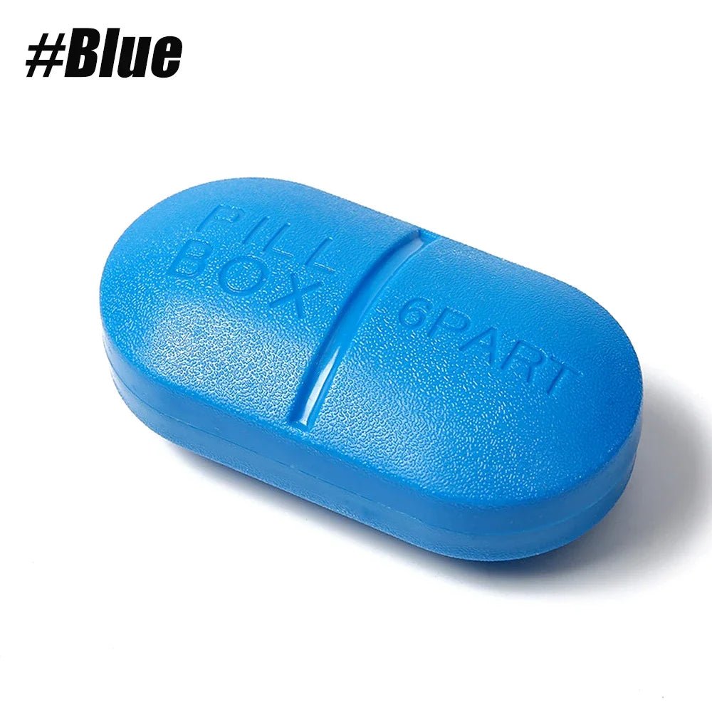 A bright blue pill-shaped plastic container embossed with 'FILL BOX' and '6PART', shown on a white background with a black '#Blue' text overlay in the top-left corner.