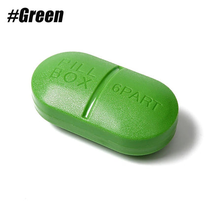 A green capsule-shaped box with embossed text reading 'GREEN BOX' and '6SPN1' on a white background, with the hashtag '#Green' in the top left corner.