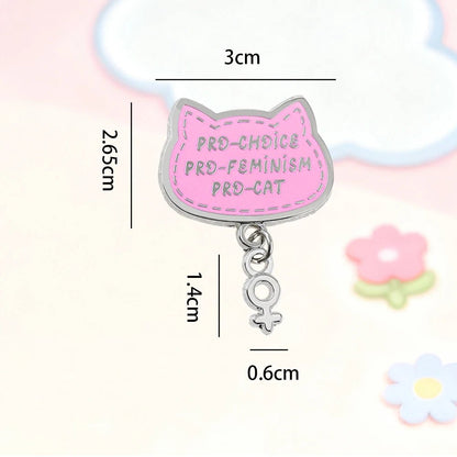 Pink cat-shaped badge with pendant silver charm - feminist abortion pro-choice cat badge
