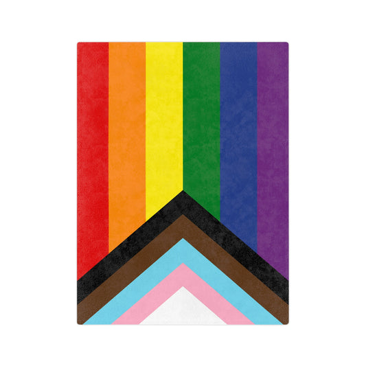 The Printify Progress Pride Flag Velveteen Microfiber Blanket features rainbow stripes and chevrons in black, brown, light blue, pink, and white for inclusivity. Crafted by a trans and queer-owned business, it's made of super-soft fleece for celebrating diversity with comfort.